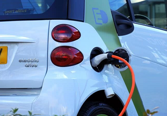 How will the rise in electric vehicles impact urban logistics and industrial developments?